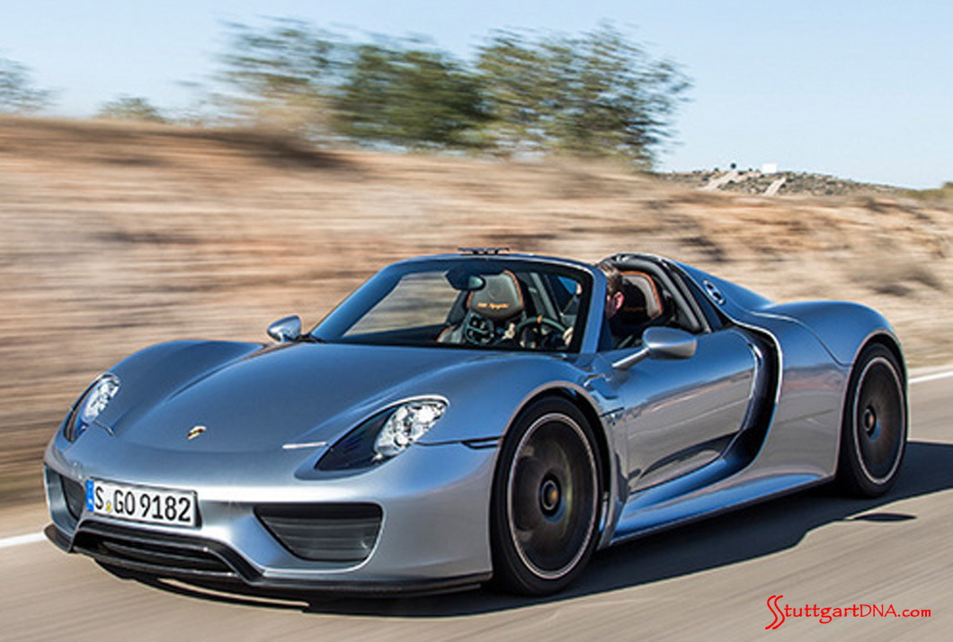 Porsche 918 Spyder Robb Report Car of 2015 Porsche 918 Spyder Robb Report Car of 2015: A silver 918 Spyder, seen here from the left front-view, cruisin' on down the road. Source: PCNA