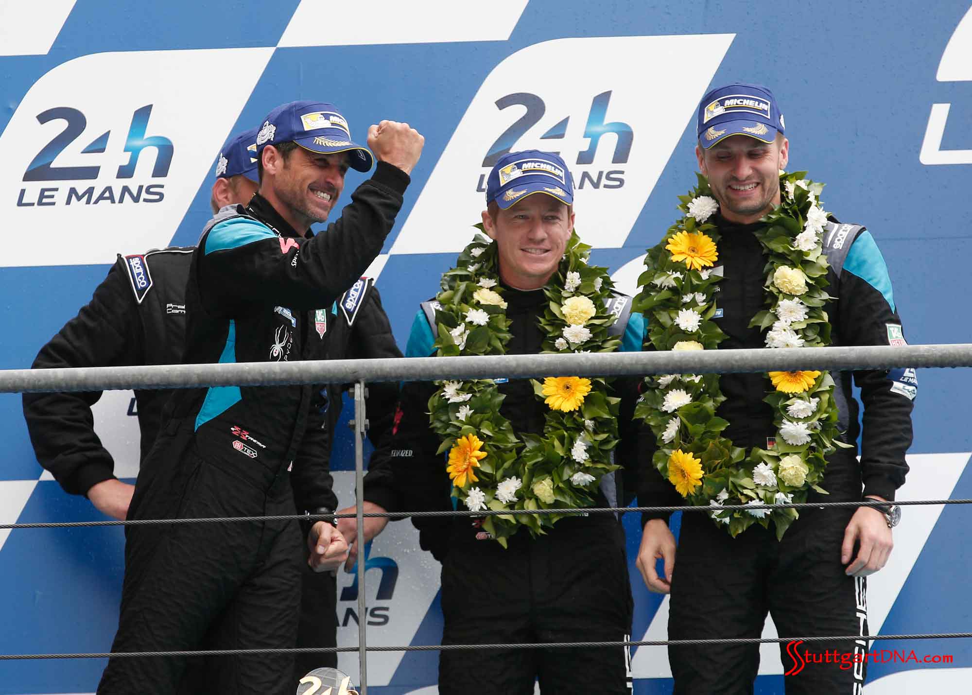 Patrick Dempsey Porsche scores Le Mans second place Patrick Dempsey Porsche scores Le Mans second place: Dempsey Proton team celebrating P2 on 2015 Le Mans podum for Porsche. Patrick Dempsey, Patrick Long, Marco Seefried (l-r). Credit: Porsche AG