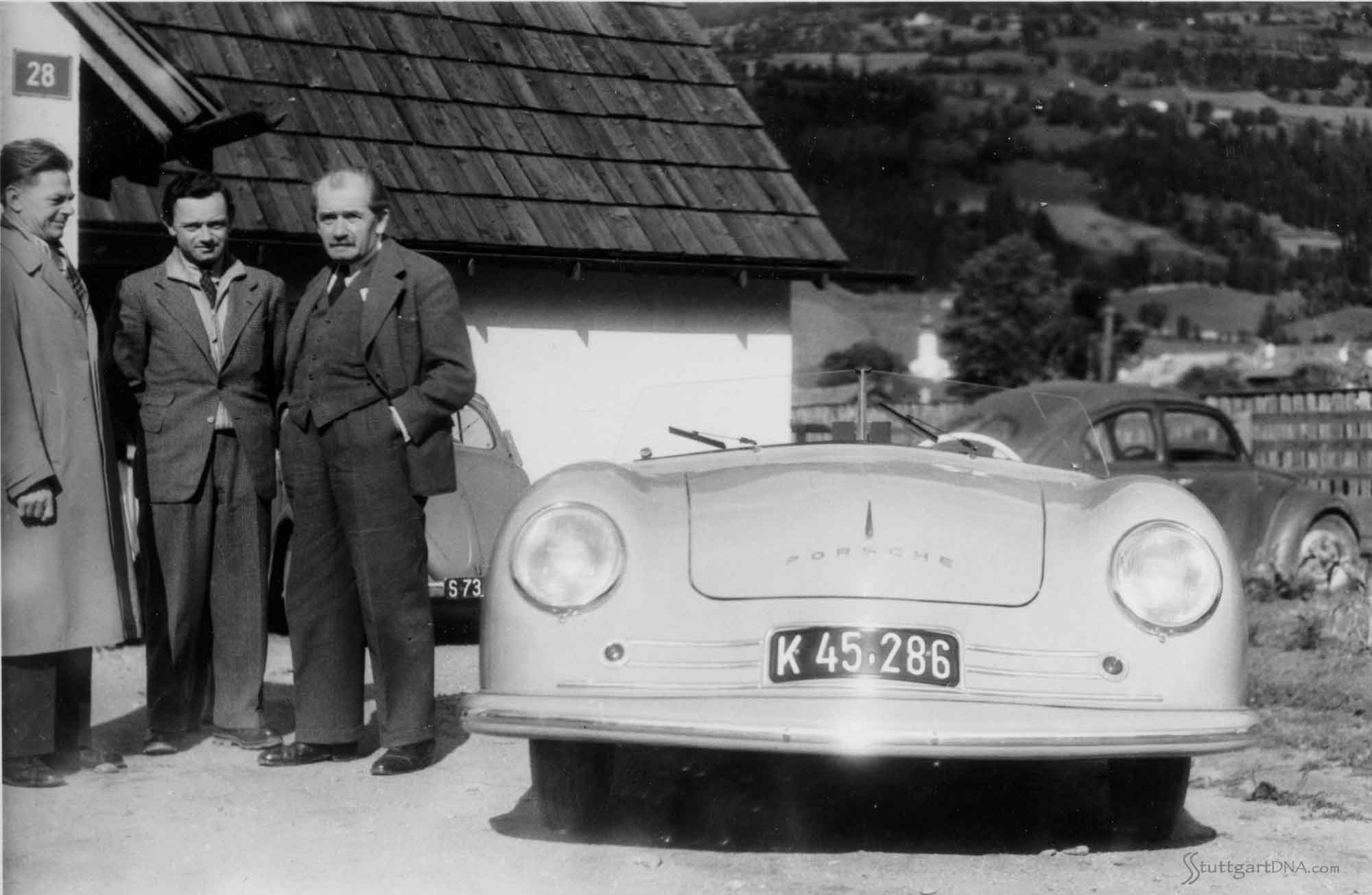 Porsche No. 1 Porsche No. 1: Porsche designer Erwin Komenda, Ferry Porsche and Dr. Ferdinand Porsche with Porsche No. 1. Credit: Porsche AG
