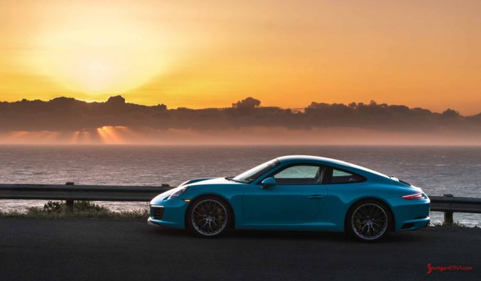 Miami Blue Carrera, left side, at sunset. Credit: PCNA How buying a new Porsche can save you money: Seen in the pretty shot is a Miami Blue Carrera, left side, at sunset. Credit: PCNA