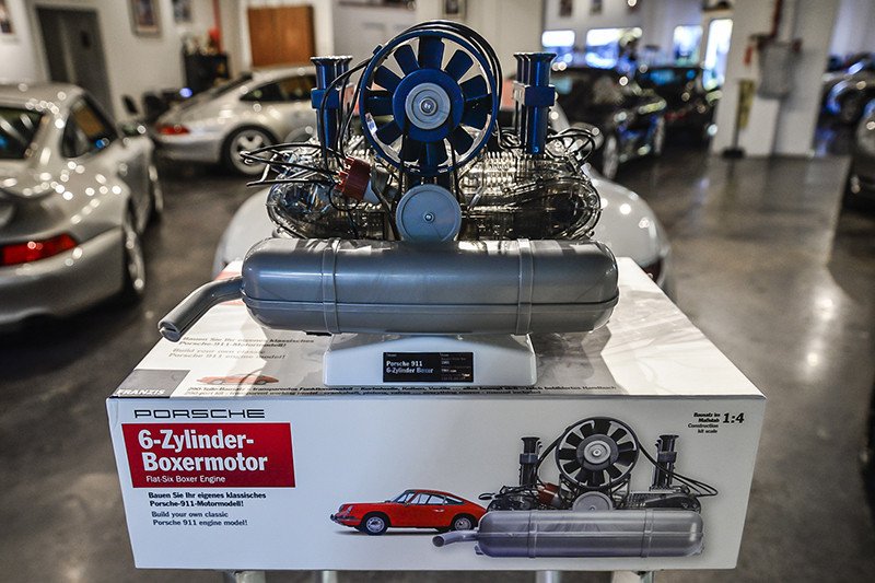 Six-cylinder engine kit on kit packaging with 911s in bg. Credit: Flat Six Fanatics Franzis’ Porsche Flat-Six Engine Scale Model Kit: Six-cylinder engine kit on kit packaging with 911s in bg. Credit Flat Six Fanatics