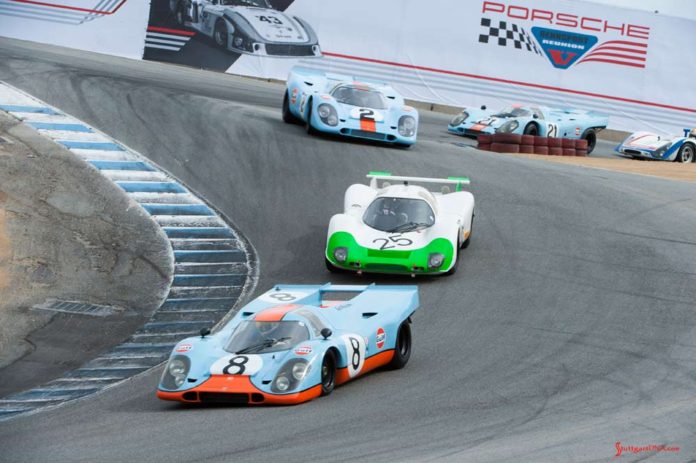 Rennsport Reunion V: 917s and others on Corkscrew. Credit: Porsche AG Porsche unveils official Rennsport Reunion VI poster - Rennsport Reunion V: We see here Porsche Gulf-liveried 917s and other Porsche racecars winding down Laguna Seca's famed Corkscrew at the 5th Reunion. Credit: Porsche AG
