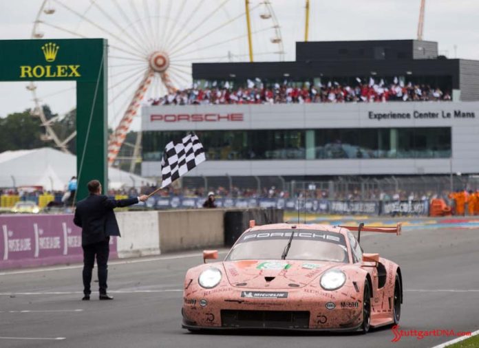 No 92 Pink Pig RSR with PEC in bg. Credit: Porsche AG Porsche wins both 2018 Le Mans 24-Hour GT classes: Seen here in vivid relief is the No 92 Pink Pig RSR tking th checkered flag, with PEC in bg. Credit: Porsche AG