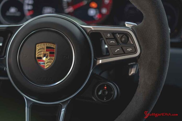 Steering wheel crest. Credit: Porsche AG Porsche second-quarter 2020 USA retail sales: Seen here is the Porsche crest centered on the steering wheel of a Porsche 911. Credit: Porsche AG.