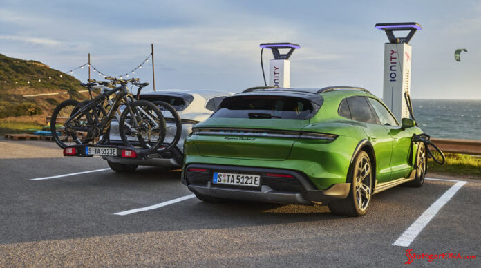 2 Taycan 4 Cross Turismos charging at beach. Credit: Porsche AG Porsche AG first-quarter 2021 worldwide sales: Depicted here are two Taycan 4 Cross Turismos charging their batteries at the seashore. Credit: Porsche AG