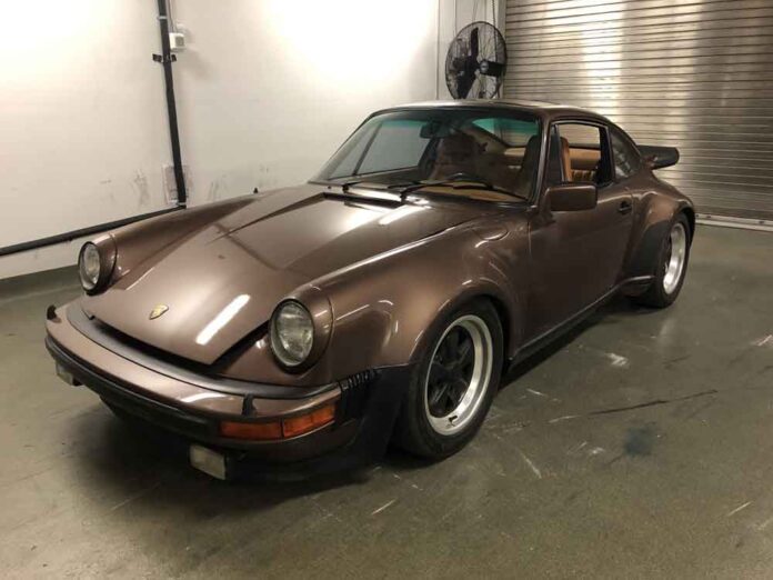 Stolen Sarasota Porsche 930, left-front-corner. Credit: Sarasota Police Department Pictured here is a police photograph of a stolen-and-recovered Copper Brown Metallic Porsche 911 930 Turbo in a garage. Credit: Sarasota Police Department.