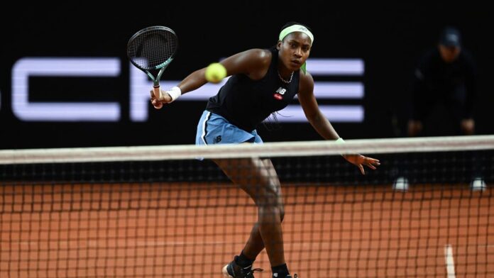 Coco Gauf poised behind net. Credit: Porsche AG US Open champ Gauff at the Porsche Grand Prix: Depicted here is US Open champ Gauff at the Porsche Grand Prix poised behind the net. Credit: Porsche AG