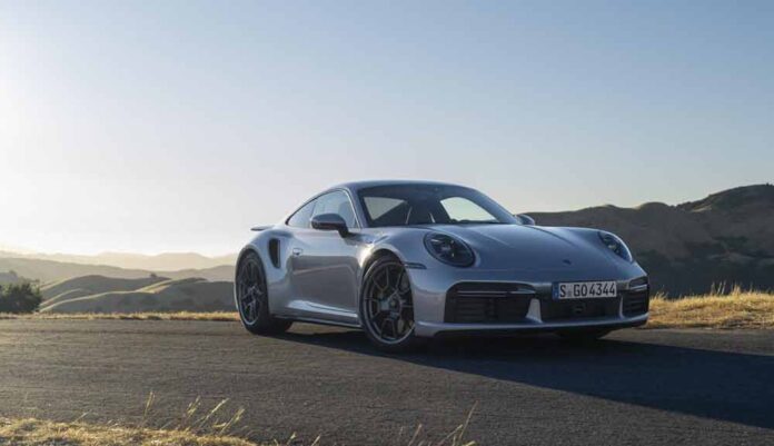 911 Turbo 50 Years model, right-front, parked. Credit: Porsche AG Introducing the Porsche 911 Turbo 50 Years model: Depicted here is a 911 Turbo 50 Years model, right-front, parked on a hilltop. Credit: Porsche AG